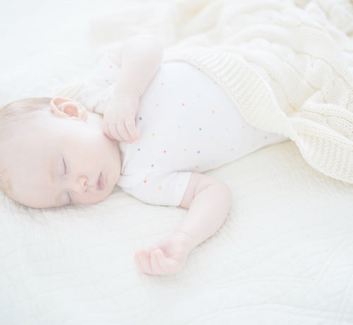 Baby sleeping with a blanket - Mustela USA - 1
