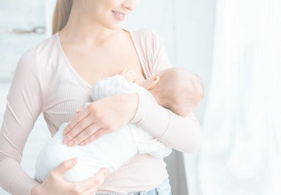 Mom breastfeeding newborn - Mustela USA - 1