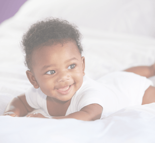 Baby getting ready to roll over - Mustela USA - 1