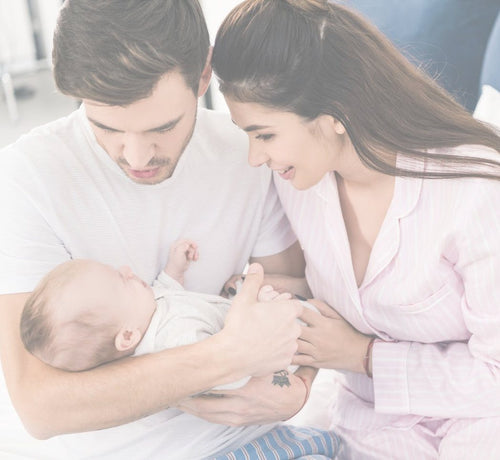 Parents holding newborn - Mustela USA - 1