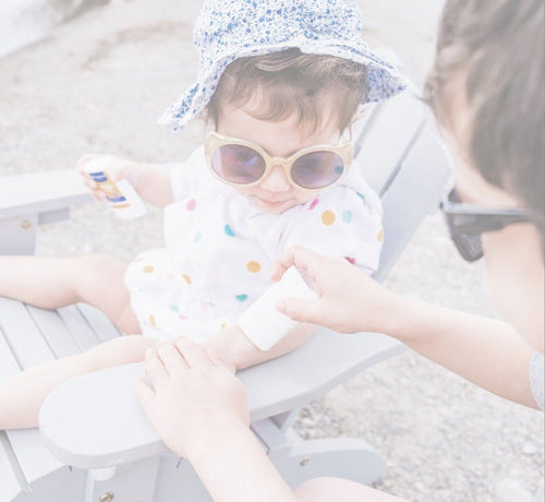 Parent applying sunscreen for eczema on baby - Mustela USA - 1
