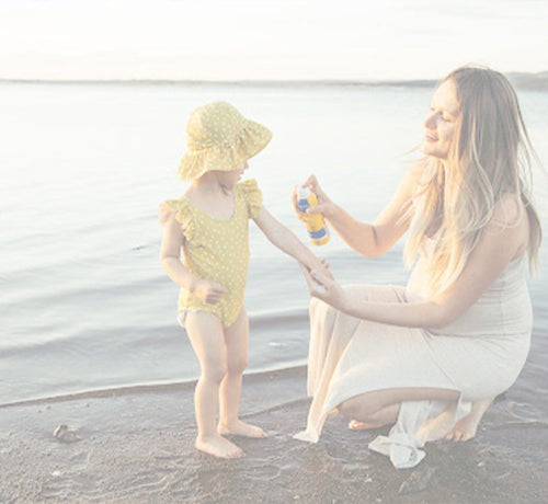 Mom applying sunscreen for sensitive skin on daughter - Mustela USA - 1