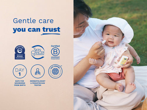 Mustela USA | Baby being held by a person with product packaging, featuring certification logos on a beige background. - Mustela USA - 4
