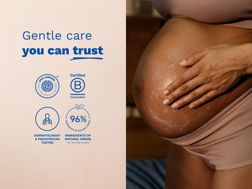 Pregnant woman applying cream on her belly next to product trust badges. - Mustela USA - 3