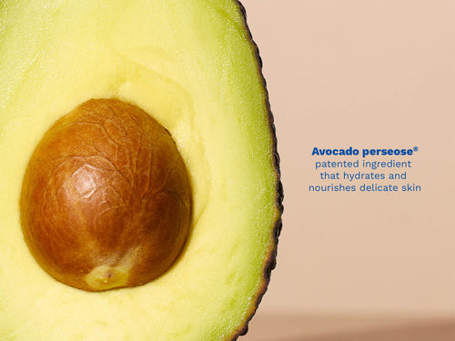 Mustela USA | Close-up of an avocado with a seed, labeled 'Avocado perseoze' on a beige background. - Mustela USA - 4