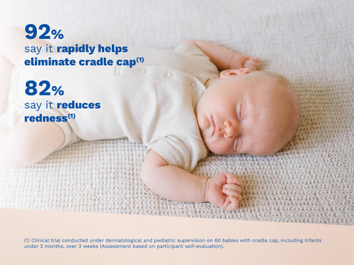 Sleeping baby lying on a textured blanket, with blue text on the left side. - Mustela USA - 2