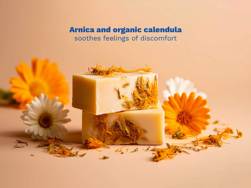Mustela USA |Two bars of soap with calendula petals and flowers on a beige surface. - Mustela USA - 3