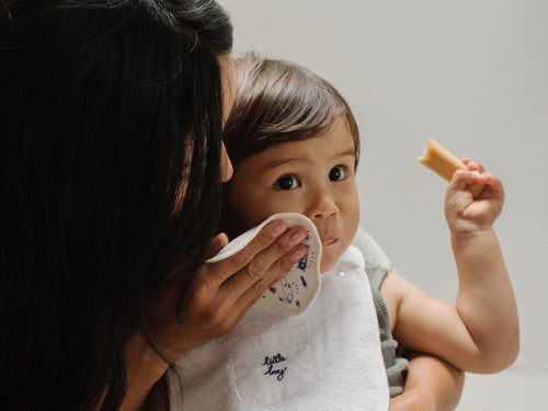 Mustela USA | Mother using Reusable Eco Wipes on a baby's face - Mustela USA - 3