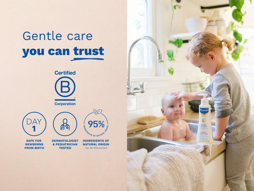 Sibling washing baby in a sink next to product safety icons. - Mustela USA - 4