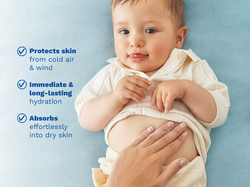 Baby lying down while caregiver applies moisturizing cream. - Mustela USA - 7