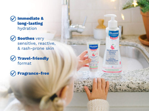 Child reaching for Mustela soothing products on a bathroom counter. - Mustela USA - 3