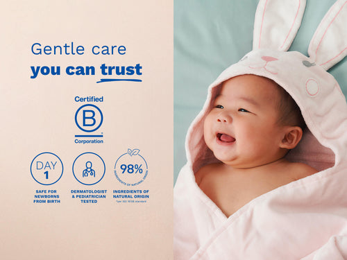 Mustela USA | Smiling baby wrapped in a pink hooded towel with bunny ears. - Mustela USA - 5