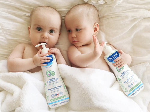 Mustela USA | Two babies holding Gentle Cleansing Gel Pump - Mustela USA - 3
