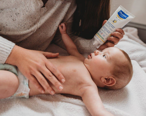 Mother applying Nourishing Lotion with Cold Cream on baby - Mustela USA - 3