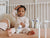 Image of baby boy sitting and holding Stelatopia Foam Shampoo
